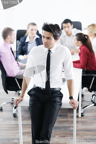 Image of young business man at meeting