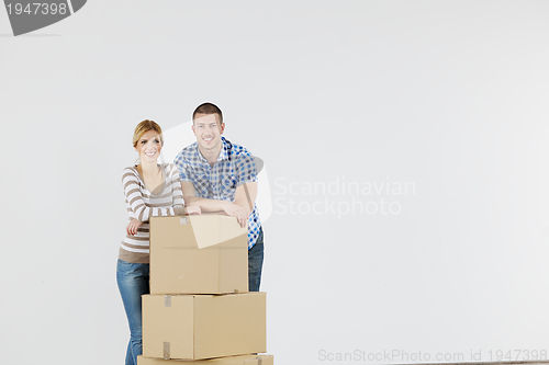 Image of Young couple moving in new home