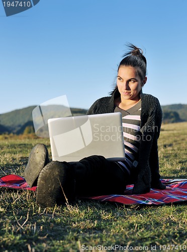 Image of young teen girl work on laptop outdoor