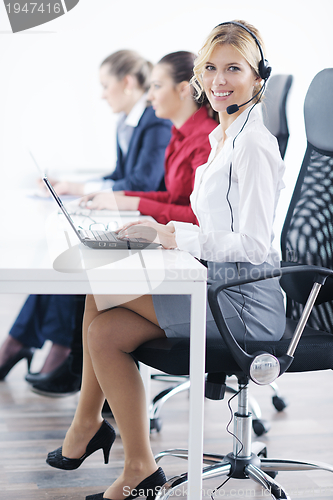 Image of business woman group with headphones
