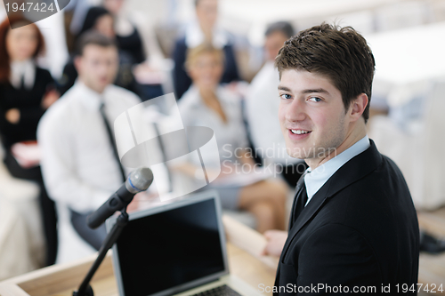 Image of Young  business man giving a presentation on conference