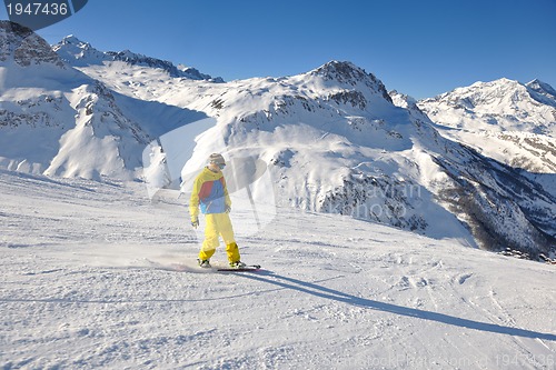 Image of skiing on fresh snow at winter season at beautiful sunny day