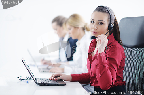 Image of business woman group with headphones