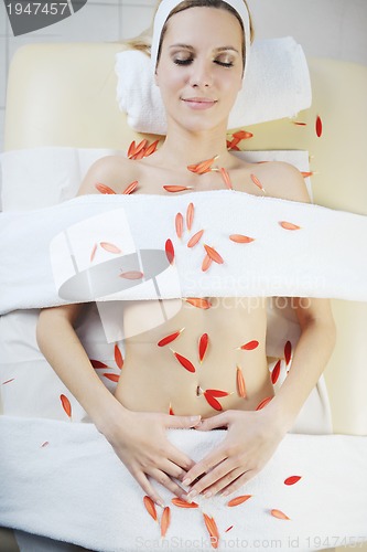 Image of Beautiful young woman in spa