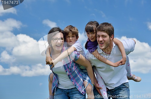 Image of happy young family have fun outdoors