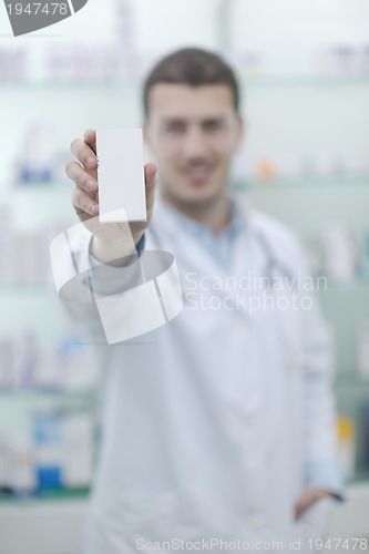 Image of pharmacist chemist man in pharmacy drugstore