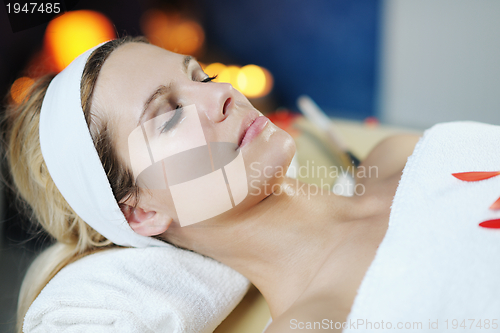 Image of Beautiful young woman in spa
