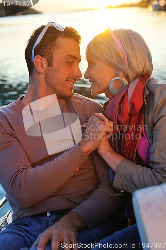 Image of couple in love  have romantic time on boat