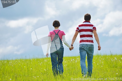 Image of romantic young couple in love together outdoor