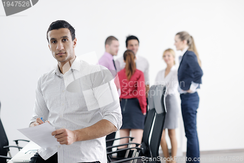 Image of young business man at meeting