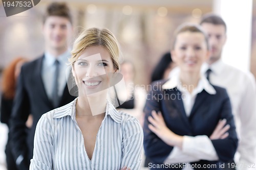Image of business woman standing with her staff at conference
