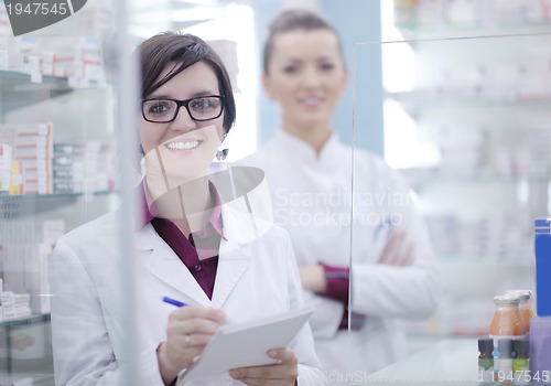 Image of team of pharmacist chemist woman  in pharmacy drugstore