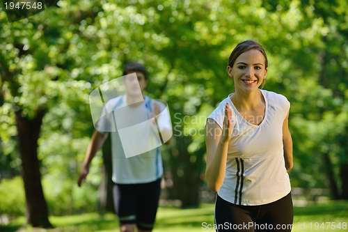 Image of Young couple jogging