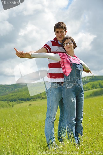 Image of romantic young couple in love together outdoor