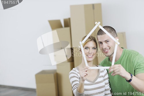 Image of Young couple moving in new home