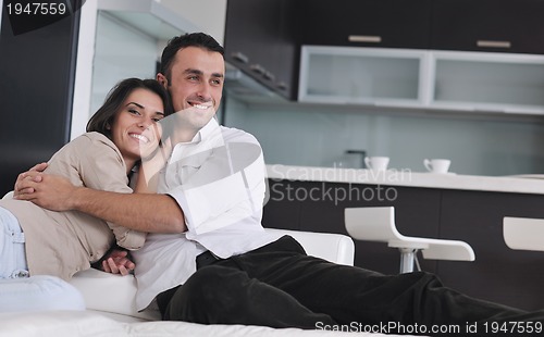 Image of happy young couple relax at home