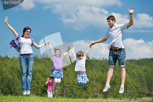Image of happy young family have fun outdoors