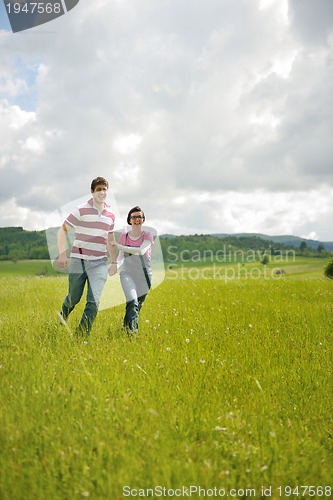 Image of romantic young couple in love together outdoor