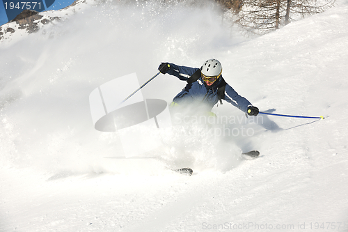 Image of skiing on fresh snow at winter season at beautiful sunny day