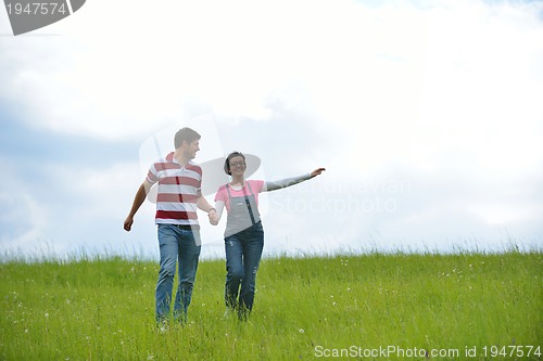 Image of romantic young couple in love together outdoor