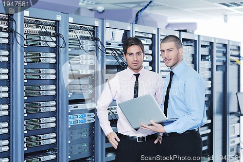 Image of it enineers in network server room