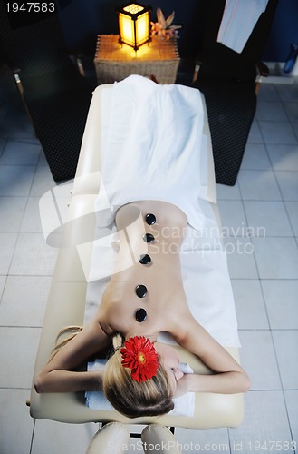 Image of Beautiful young woman in spa