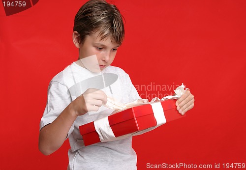 Image of Child opening a present