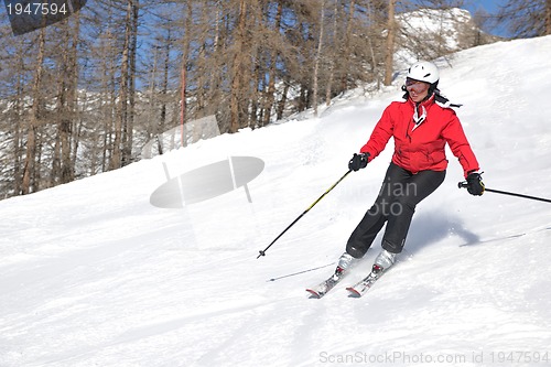 Image of skiing on fresh snow at winter season at beautiful sunny day