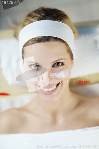 Image of Beautiful young woman in spa