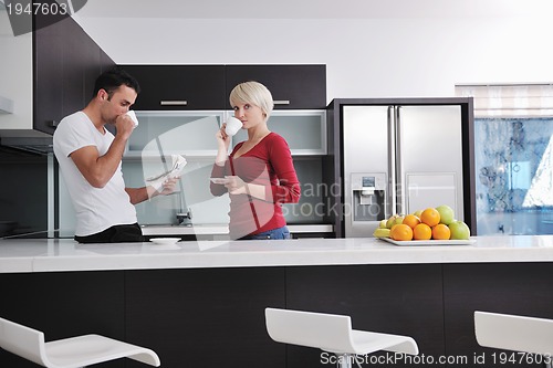 Image of young couple have fun in modern kitchen