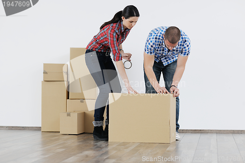 Image of Young couple moving in new house