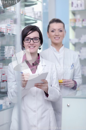 Image of team of pharmacist chemist woman  in pharmacy drugstore