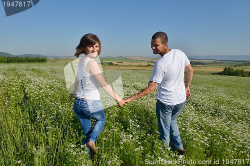 Image of happy couple in wheat field