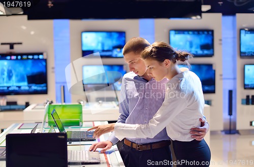 Image of people buy  in consumer electronics store