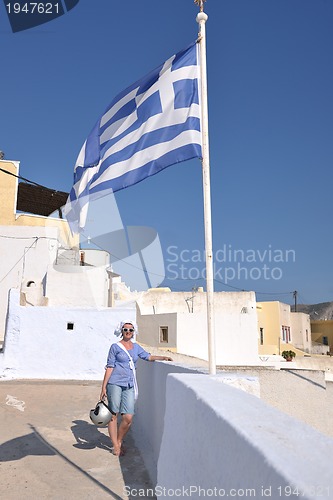 Image of Greek woman on the streets of Oia, Santorini, Greece