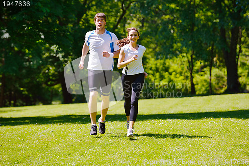 Image of Young couple jogging