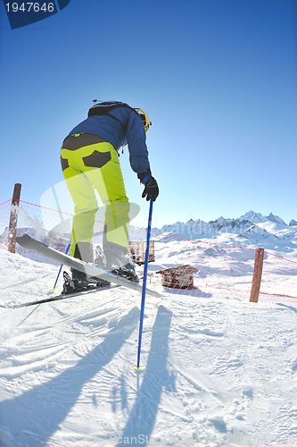 Image of skiing on fresh snow at winter season at beautiful sunny day