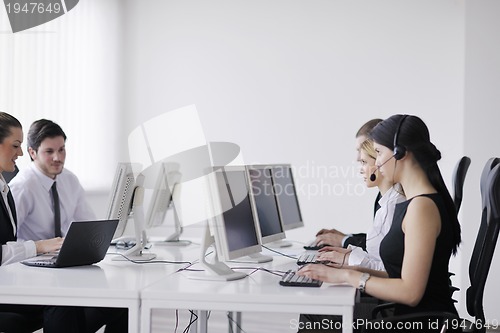 Image of business people group working in customer and help desk office