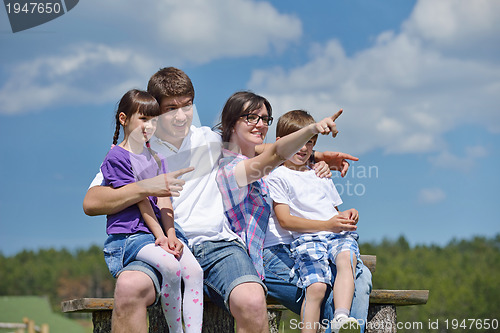 Image of happy young family have fun outdoors