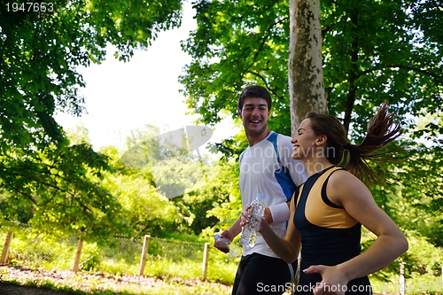 Image of Young couple jogging