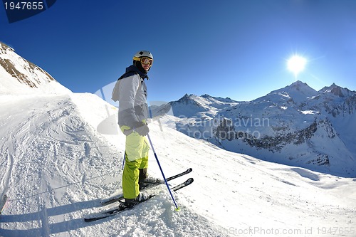 Image of skiing on fresh snow at winter season at beautiful sunny day