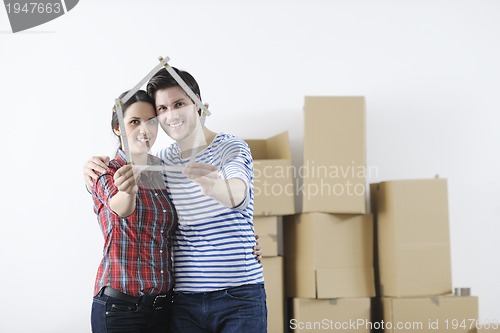 Image of Young couple moving in new home