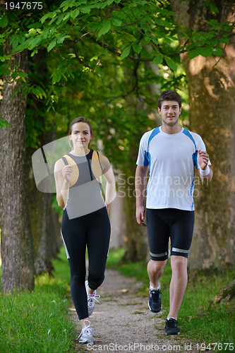 Image of Young couple jogging