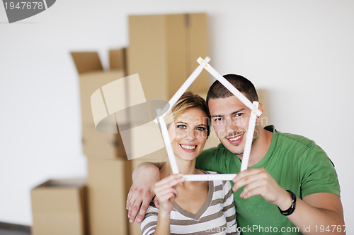 Image of Young couple moving in new house