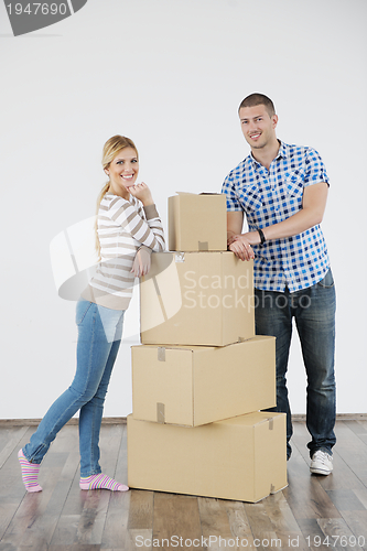 Image of Young couple moving in new home