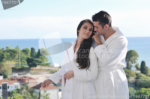 Image of couple relaxing on balcony