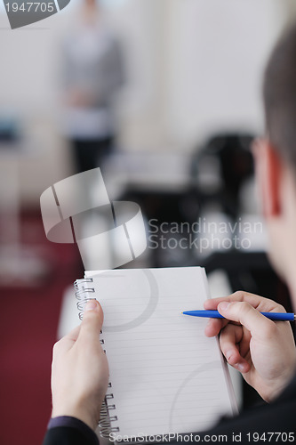 Image of business man on seminar