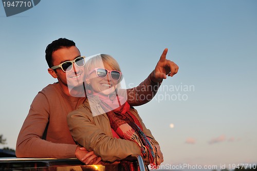 Image of couple in love  have romantic time on boat