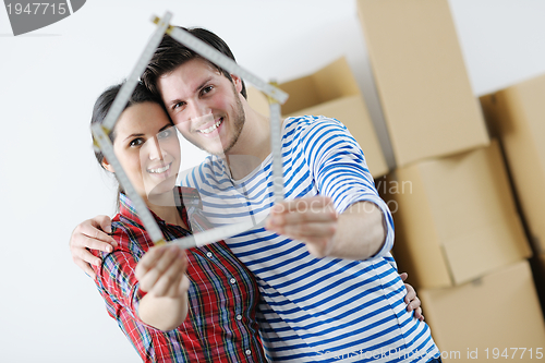 Image of Young couple moving in new house