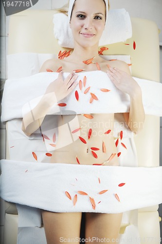 Image of Beautiful young woman in spa